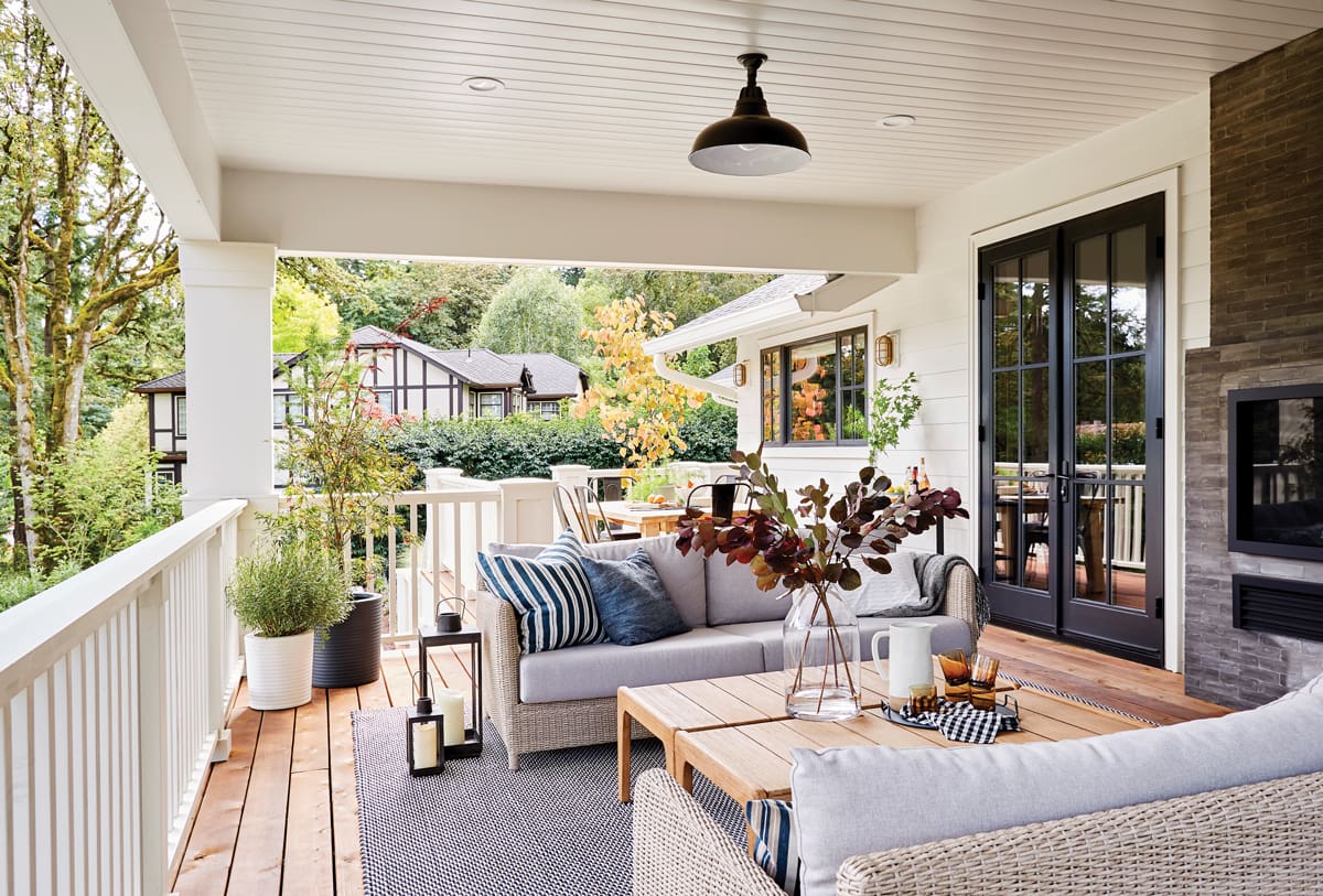 A living room with couches and tables on the patio